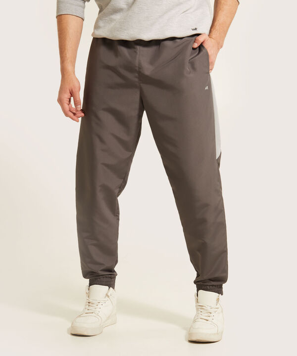 Pantalón Jogger Plano Unicolor Con Cortes Contraste, Bolsillos Laterales, Cordón Ajustable Y Elástico Interno, Sport Líneas image number null