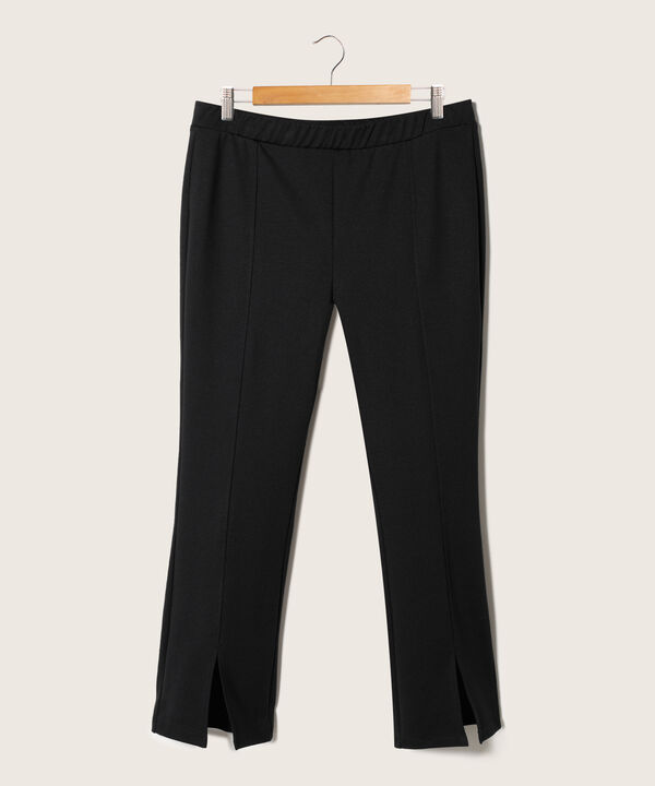 Leggings Unicolor Tipo Flare Con Abertura En Ruedo