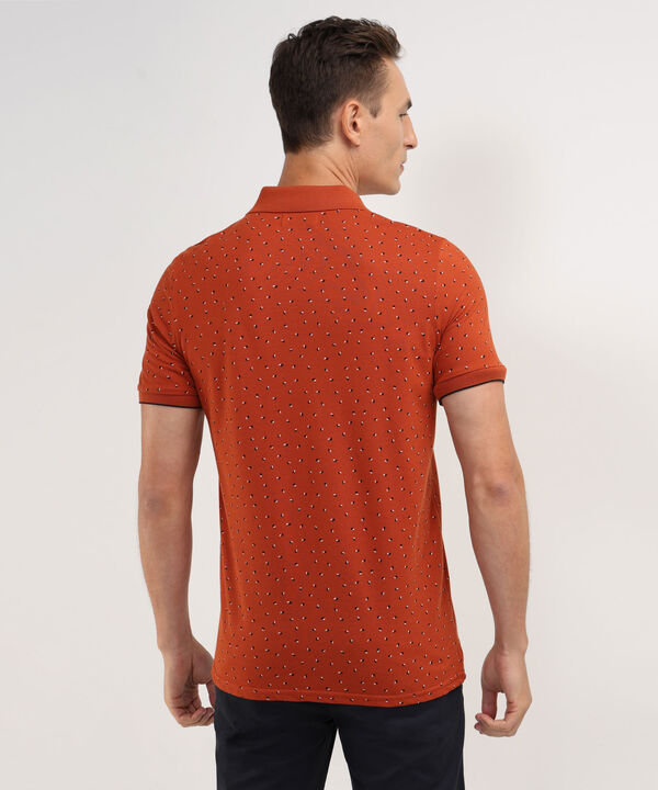 Polo Estampada, Cuello Y Puños Tejidos Con Bolsillo