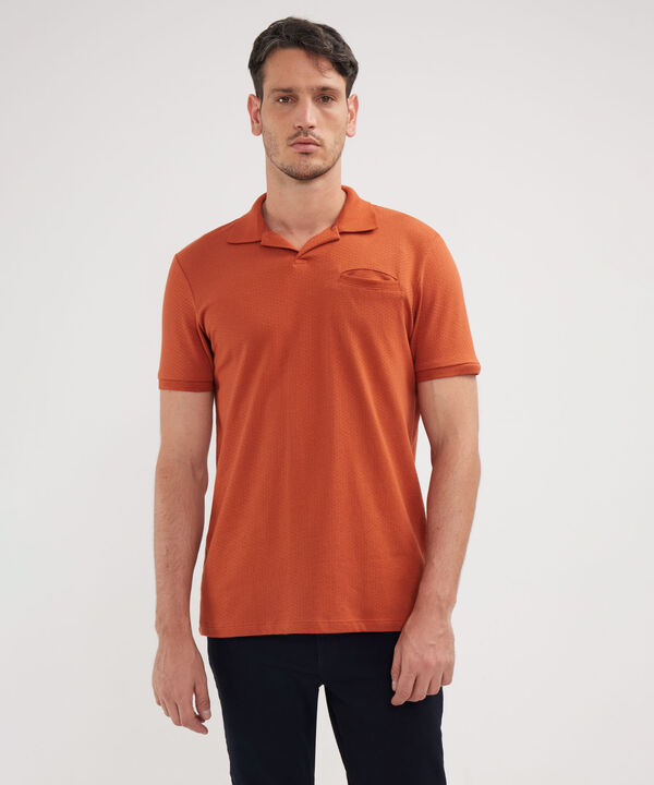 Polo Unicolor Cuello Y Puños Tejidos image number null