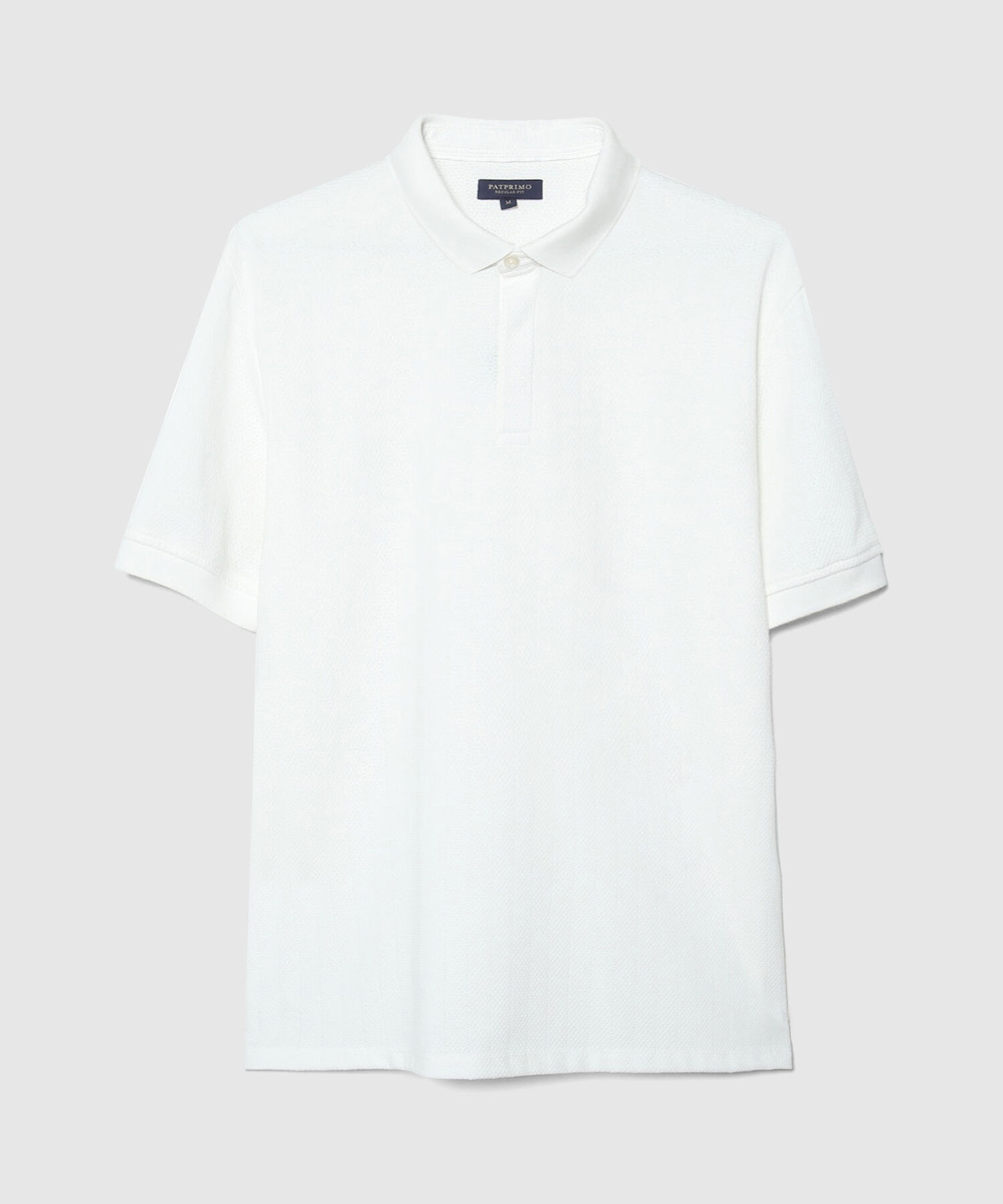 Polo Unicolor Textura Cuello Y Puños Tejidos