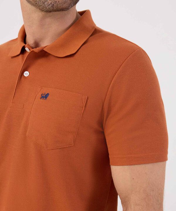 Polo Unicolor Con Bolsillo 