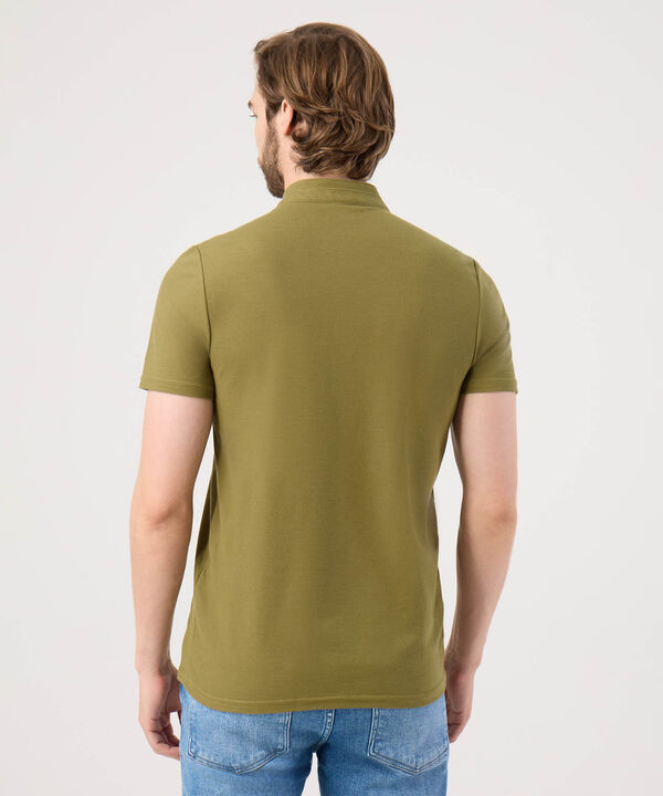 Polo Unicolor Con Bordado