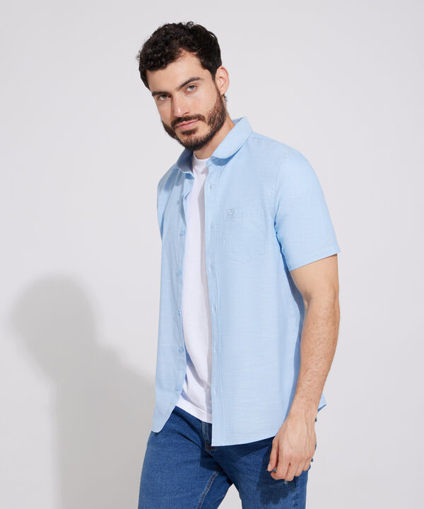 Camisa Unicolor Manga Corta Con Bolsillo Y Silueta Slim Fit