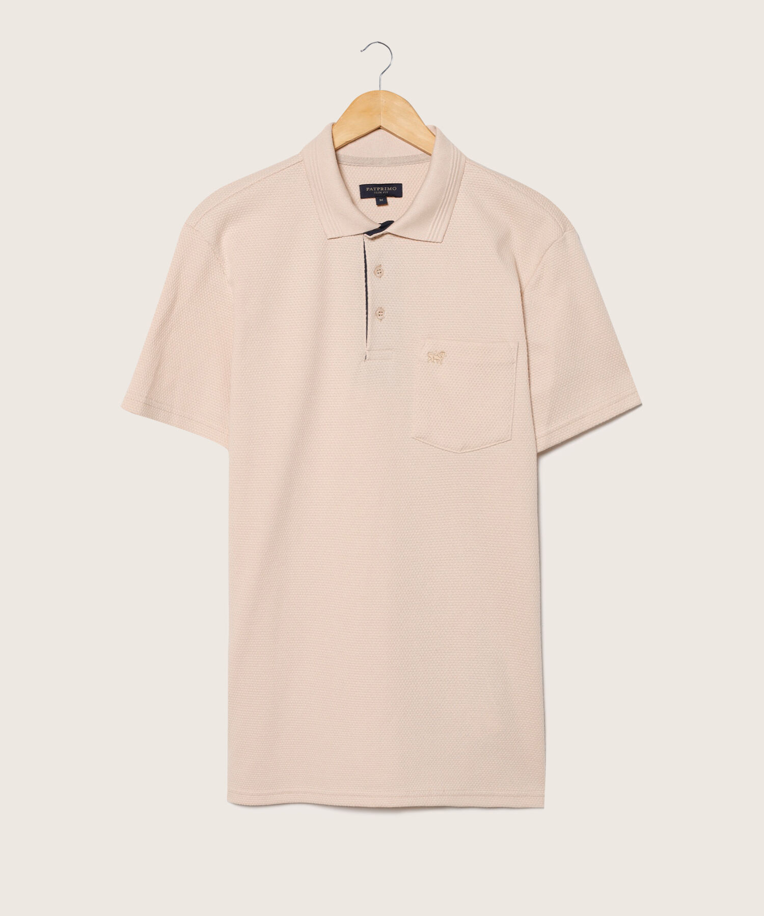 Polo Unicolor Textura, Cuello Tejido Con Bolsillo Y Silueta Slim Fit