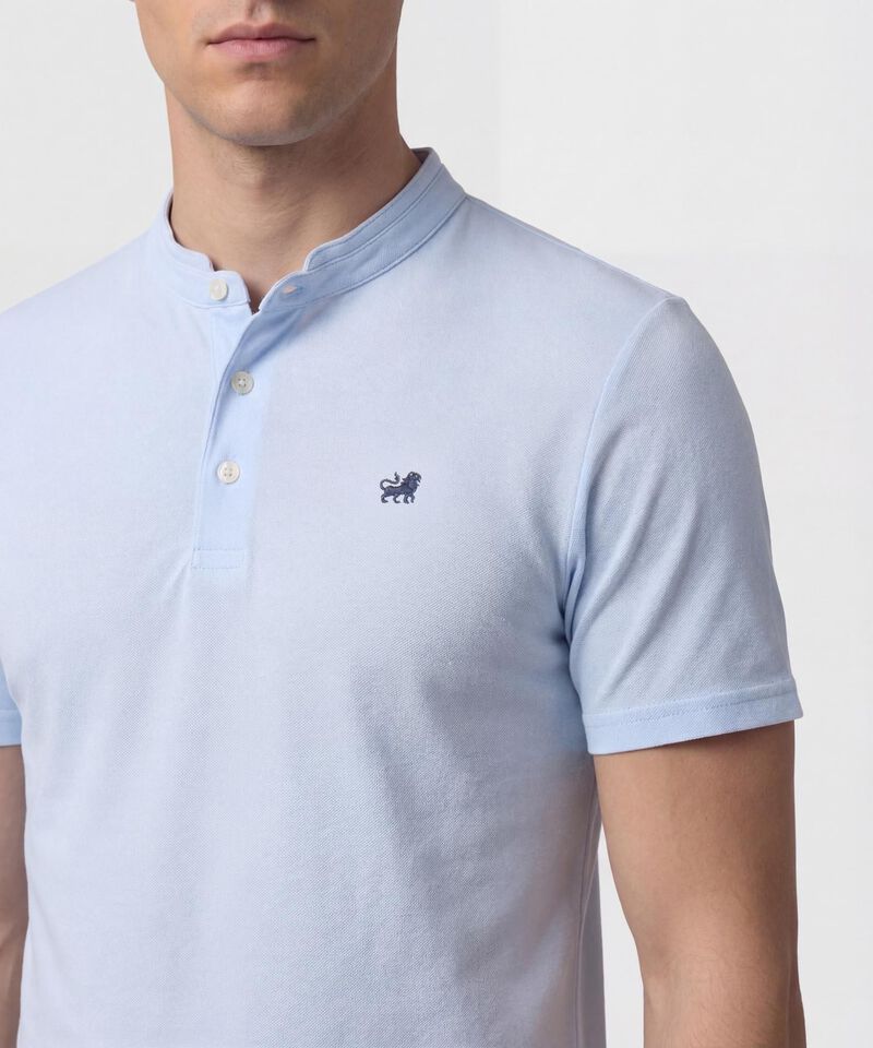 Polo Unicolor Con Bordado