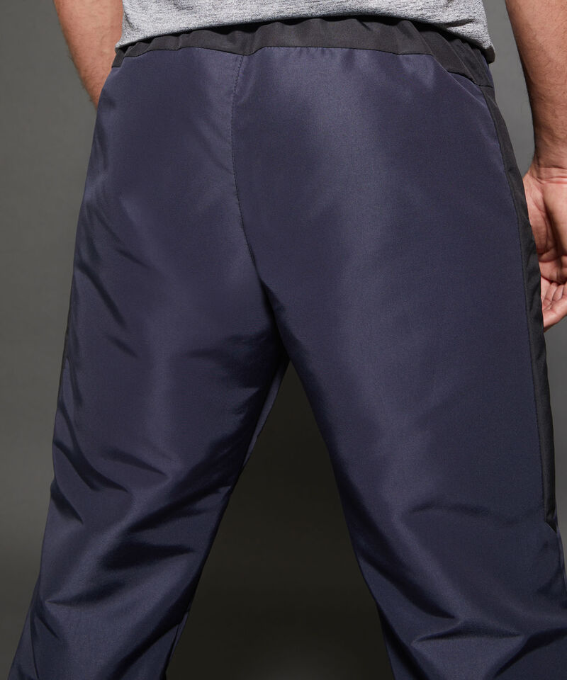 Pantalón Jogger Plano Unicolor Con Cortes Contraste, Bolsillos Laterales, Cordón Ajustable Y Elástico Interno, Sport Líneas