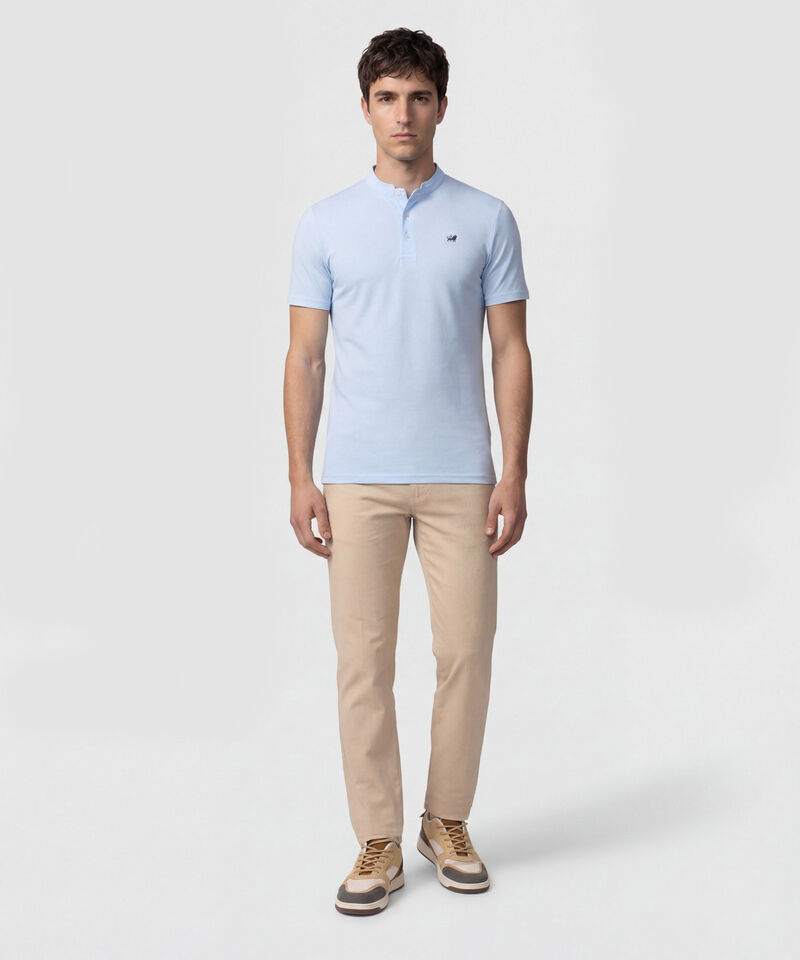 Polo Unicolor Con Bordado