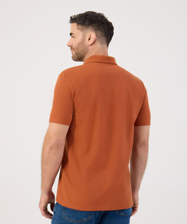 Polo Unicolor Con Bolsillo 