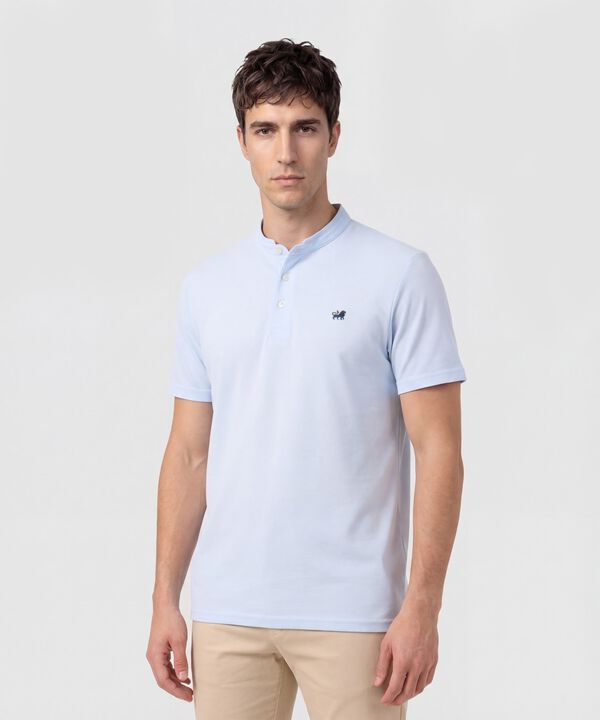 Polo Unicolor Con Bordado