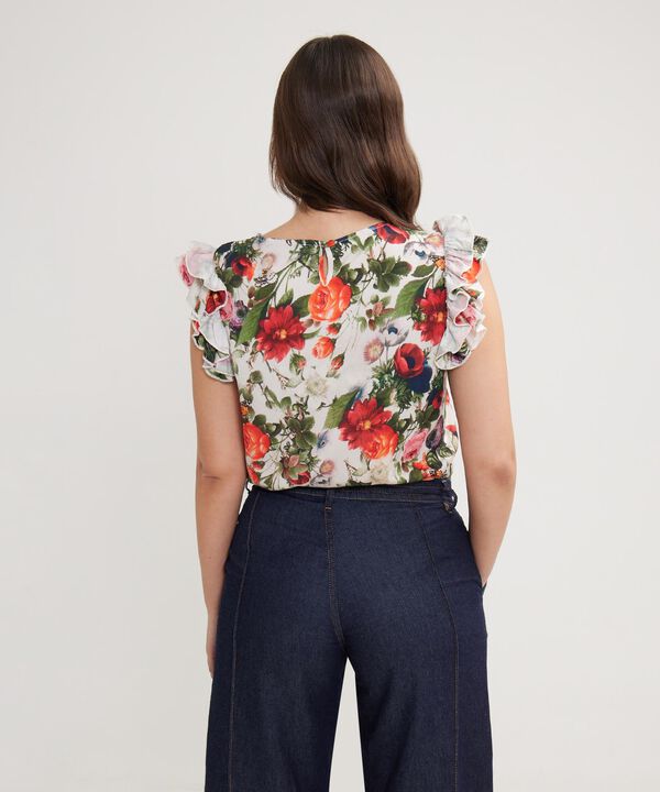 Blusa Estampada Con Boleros En Mangas