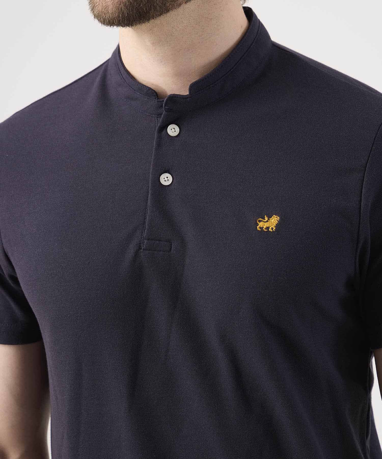 Polo Unicolor Con Bordado
