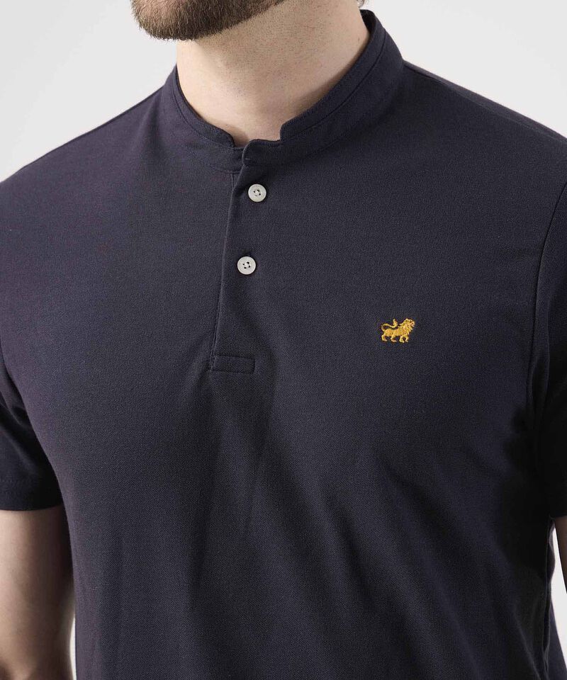 Polo Unicolor Con Bordado