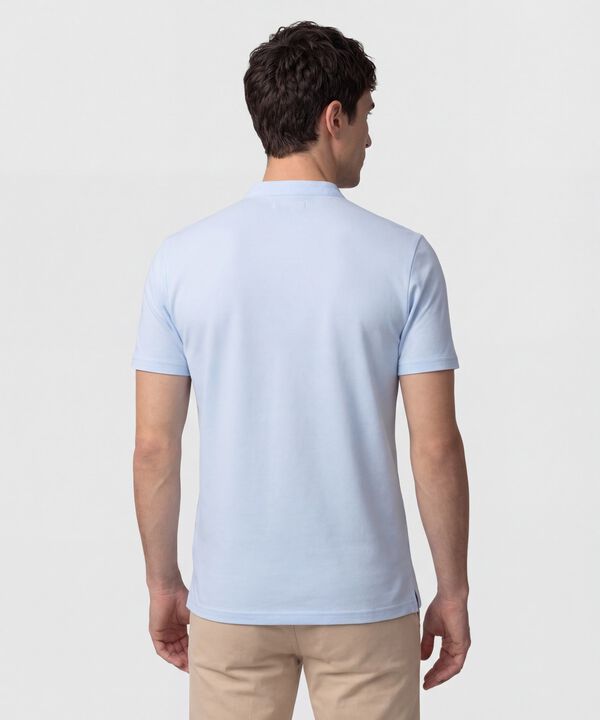 Polo Unicolor Con Bordado