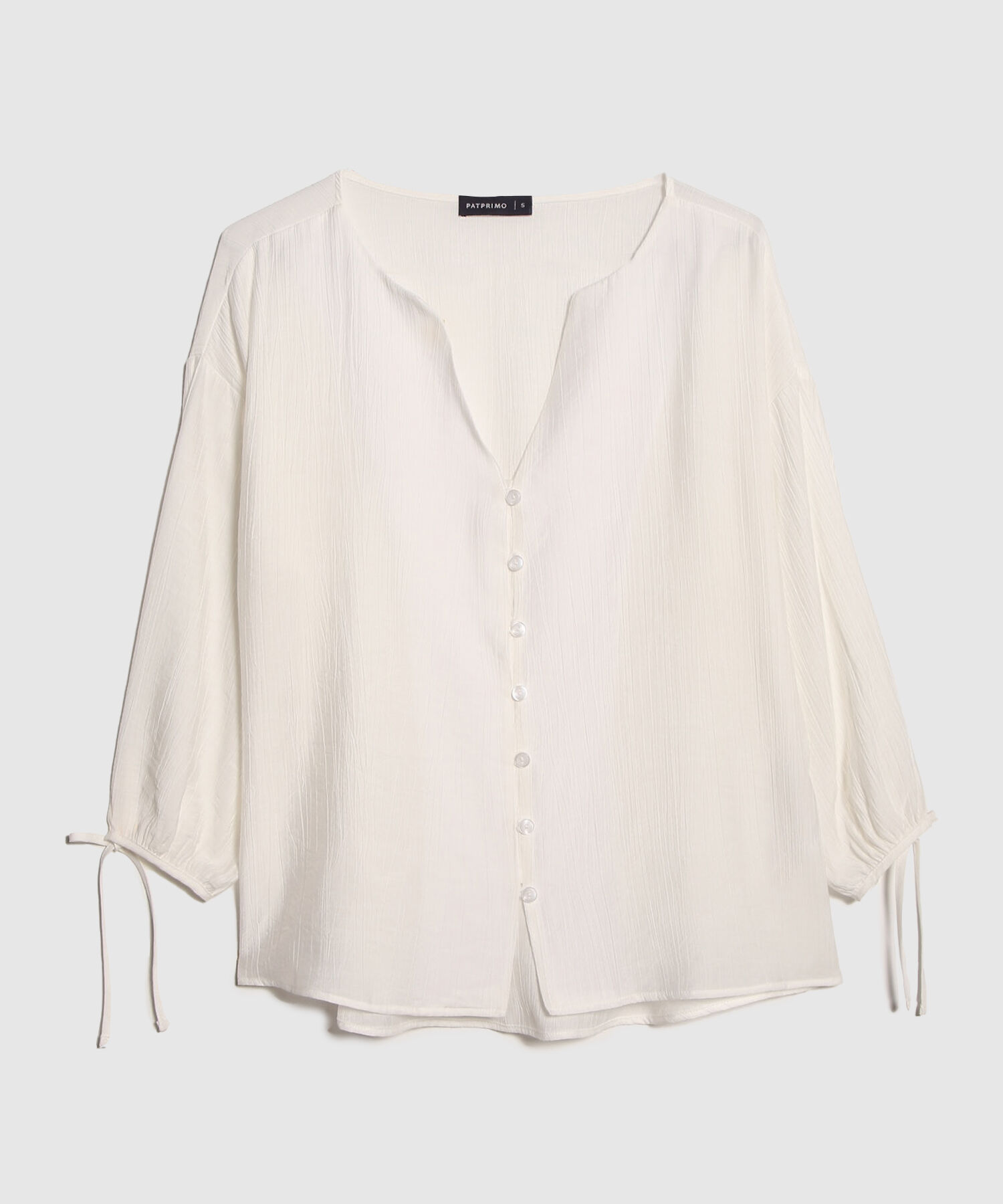 Blusa Unicolor Textura Manga Larga Con Anudado Y Botonadura En Frente