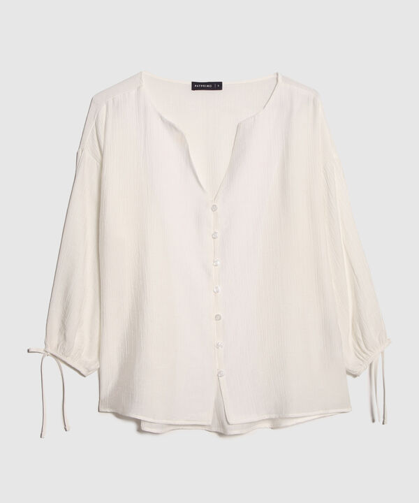 Blusa Unicolor Textura Manga Larga Con Anudado Y Botonadura En Frente